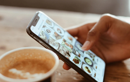 Person Using Phone And Social Media