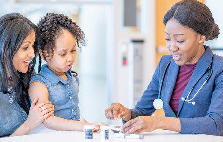 Child At Hospital With Doctor